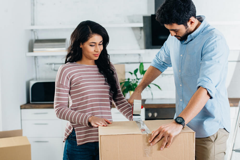 Couple moving into new house after engaging property settlement lawyers.
