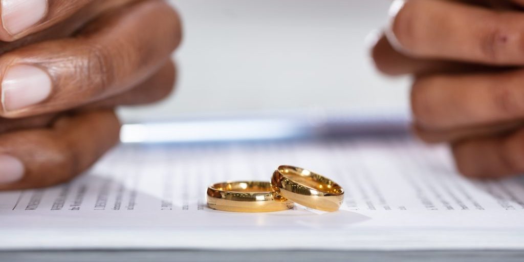 A couple with two wedding rings following divorce.