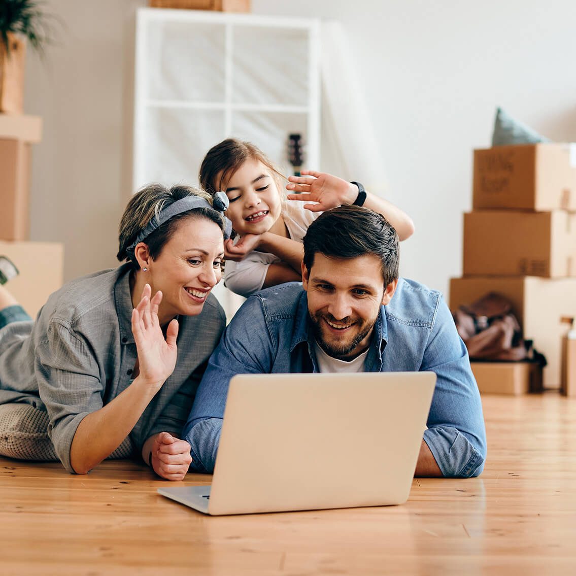 Happy family sitting in their new home after working with Lotus Legal Perth.